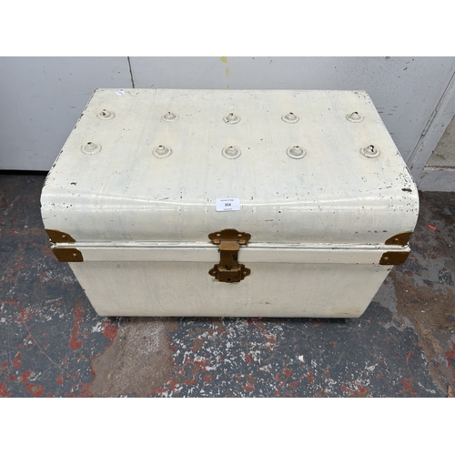 354 - An early 20th century painted metal travel trunk - approx. 42cm high x 59cm wide x 42cm deep