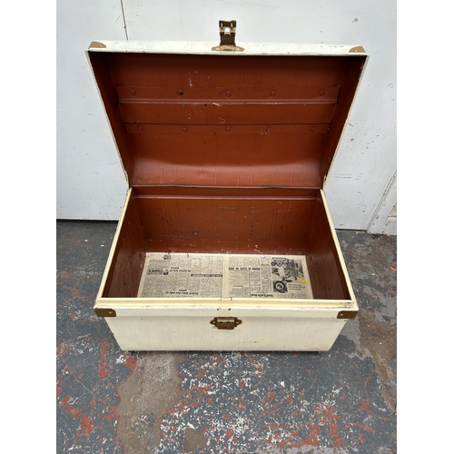 354 - An early 20th century painted metal travel trunk - approx. 42cm high x 59cm wide x 42cm deep