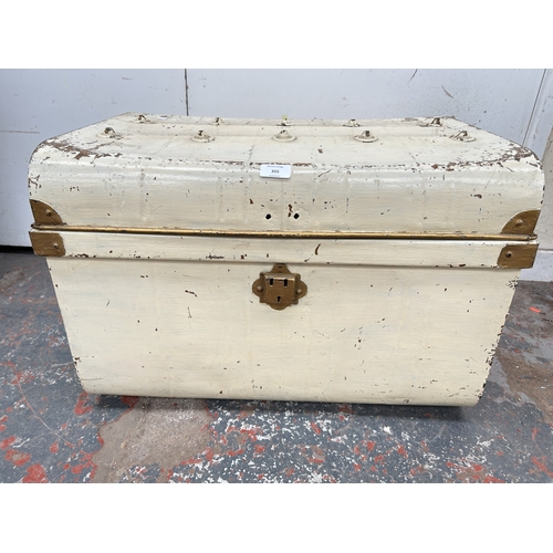 355 - An early 20th century painted metal travel trunk - approx. 42cm high x 59cm wide x 42cm deep