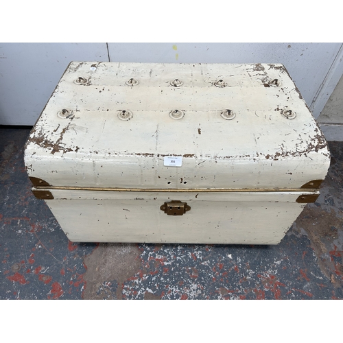 355 - An early 20th century painted metal travel trunk - approx. 42cm high x 59cm wide x 42cm deep