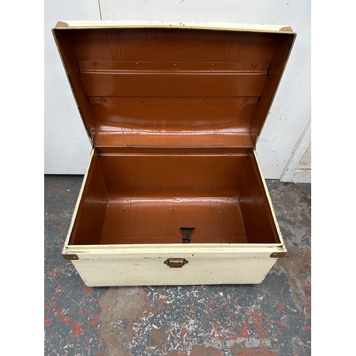 355 - An early 20th century painted metal travel trunk - approx. 42cm high x 59cm wide x 42cm deep