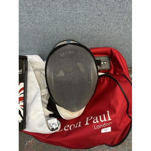 1217 - A collection of Leon Paul fencing equipment to include sabre, mask, gloves etc.