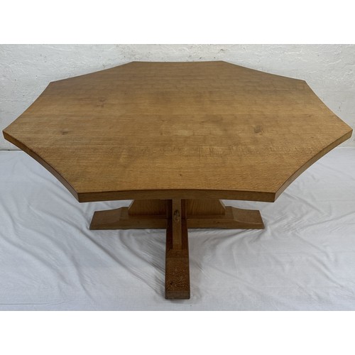 316 - A Robert 'Mouseman' Thompson adzed oak octagonal dining table - approx. 74cm high x 135cm wide x 135... 