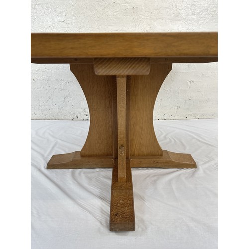 316 - A Robert 'Mouseman' Thompson adzed oak octagonal dining table - approx. 74cm high x 135cm wide x 135... 