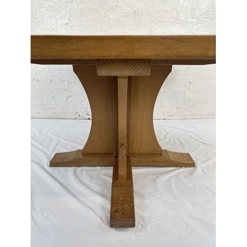 316 - A Robert 'Mouseman' Thompson adzed oak octagonal dining table - approx. 74cm high x 135cm wide x 135... 