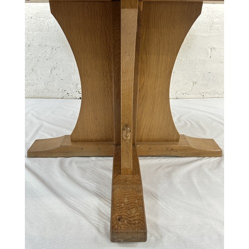 316 - A Robert 'Mouseman' Thompson adzed oak octagonal dining table - approx. 74cm high x 135cm wide x 135... 