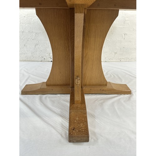 316 - A Robert 'Mouseman' Thompson adzed oak octagonal dining table - approx. 74cm high x 135cm wide x 135... 