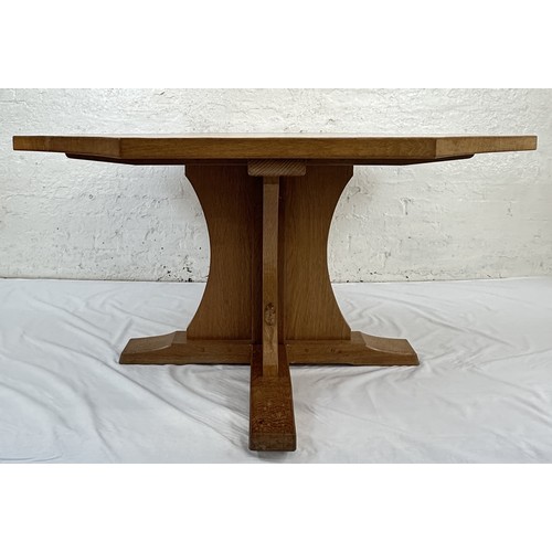 316 - A Robert 'Mouseman' Thompson adzed oak octagonal dining table - approx. 74cm high x 135cm wide x 135... 