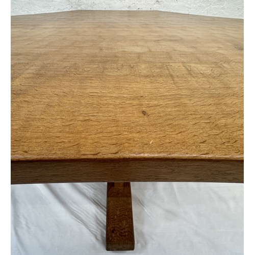 316 - A Robert 'Mouseman' Thompson adzed oak octagonal dining table - approx. 74cm high x 135cm wide x 135... 