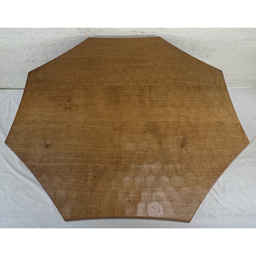 316 - A Robert 'Mouseman' Thompson adzed oak octagonal dining table - approx. 74cm high x 135cm wide x 135... 