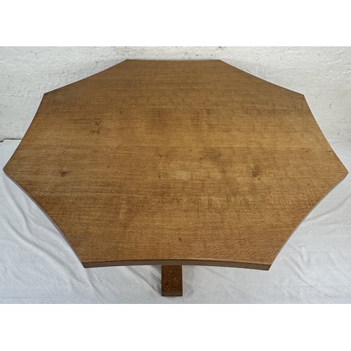 316 - A Robert 'Mouseman' Thompson adzed oak octagonal dining table - approx. 74cm high x 135cm wide x 135... 