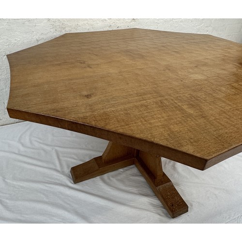 316 - A Robert 'Mouseman' Thompson adzed oak octagonal dining table - approx. 74cm high x 135cm wide x 135... 