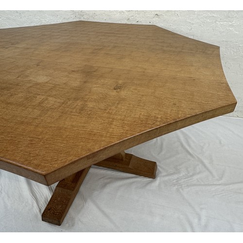 316 - A Robert 'Mouseman' Thompson adzed oak octagonal dining table - approx. 74cm high x 135cm wide x 135... 