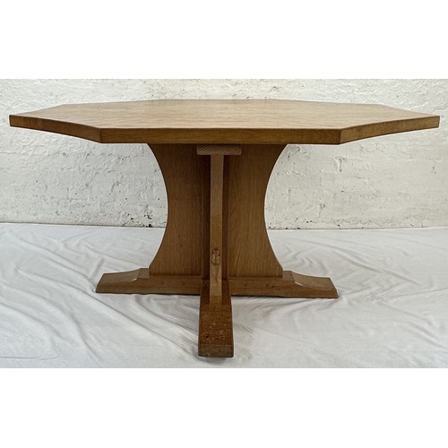 316 - A Robert 'Mouseman' Thompson adzed oak octagonal dining table - approx. 74cm high x 135cm wide x 135... 