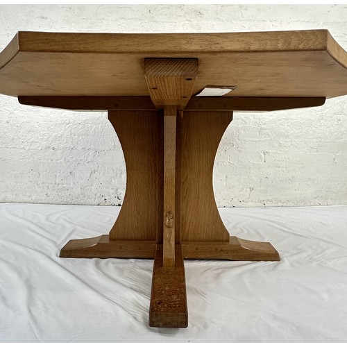 316 - A Robert 'Mouseman' Thompson adzed oak octagonal dining table - approx. 74cm high x 135cm wide x 135... 