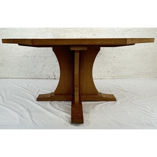 316 - A Robert 'Mouseman' Thompson adzed oak octagonal dining table - approx. 74cm high x 135cm wide x 135... 