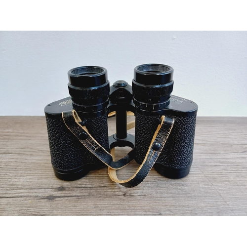 1076 - A pair of Carl Zeiss Jenoptem 8x30w multi-coated binoculars