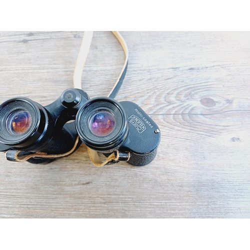 1076 - A pair of Carl Zeiss Jenoptem 8x30w multi-coated binoculars