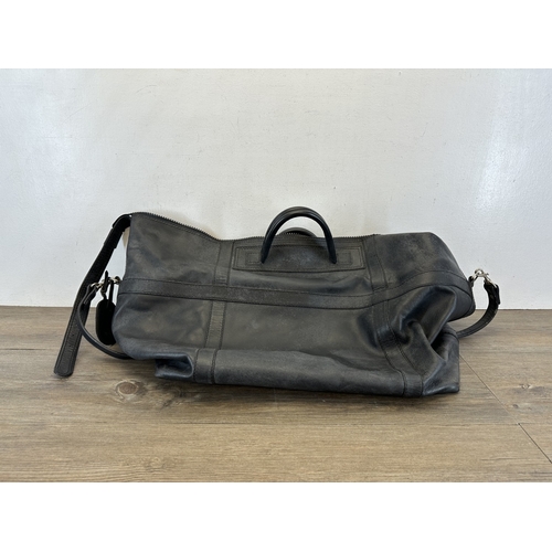 734 - A Samsonite black leather holdall