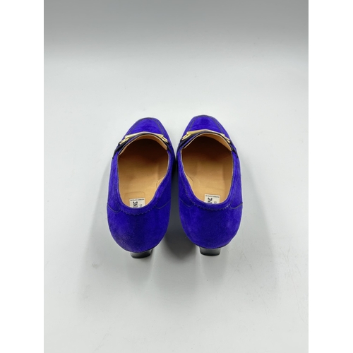 737 - Two pairs of Celine of Paris heeled shoes, one purple suede and one black crocodile skin effect leat... 