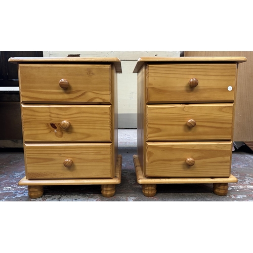 100 - A pair of pine bedside chests of drawers - approx. 62cm high x 45cm wide x 43cm deep