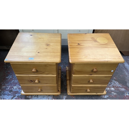 100 - A pair of pine bedside chests of drawers - approx. 62cm high x 45cm wide x 43cm deep