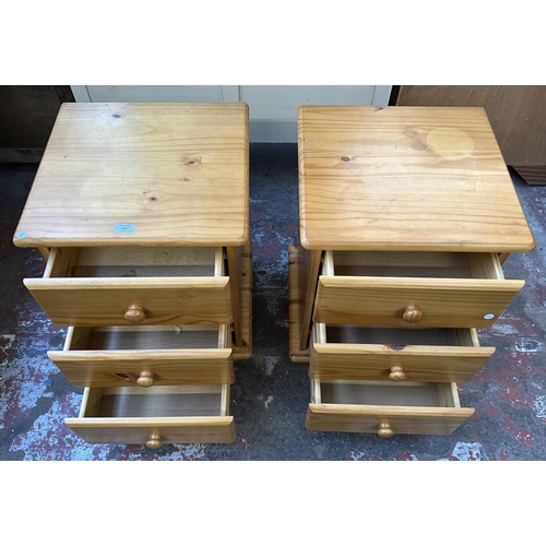 100 - A pair of pine bedside chests of drawers - approx. 62cm high x 45cm wide x 43cm deep