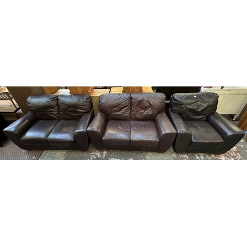 102 - A brown leather three piece lounge suite comprising armchair and pair of two seater sofas