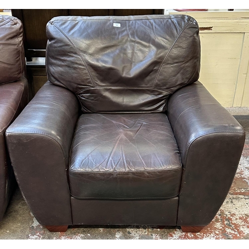 102 - A brown leather three piece lounge suite comprising armchair and pair of two seater sofas