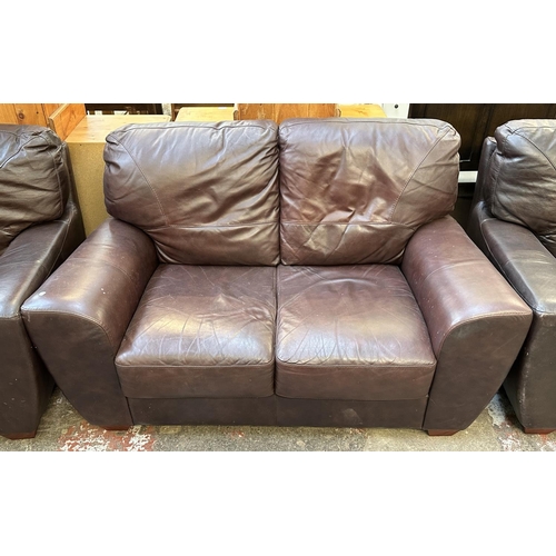 102 - A brown leather three piece lounge suite comprising armchair and pair of two seater sofas