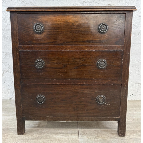 104 - A 1930s oak chest of drawers - approx. 74cm high x 60cm wide x 45cm deep