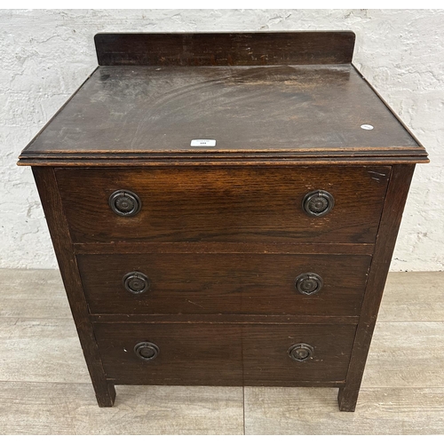104 - A 1930s oak chest of drawers - approx. 74cm high x 60cm wide x 45cm deep