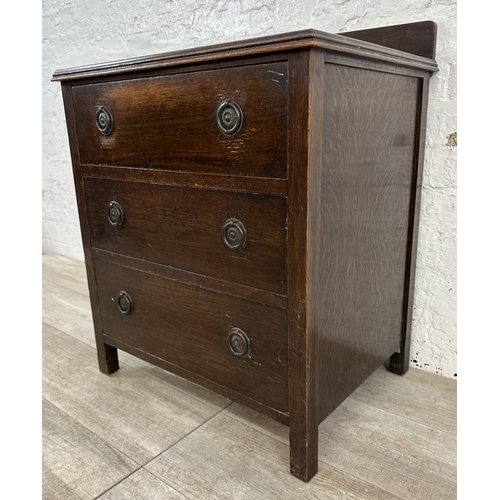 104 - A 1930s oak chest of drawers - approx. 74cm high x 60cm wide x 45cm deep