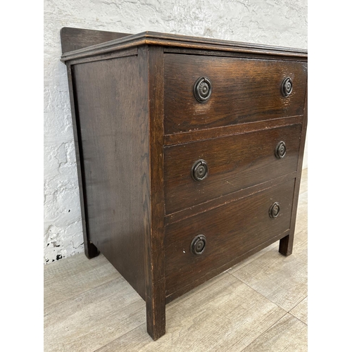 104 - A 1930s oak chest of drawers - approx. 74cm high x 60cm wide x 45cm deep