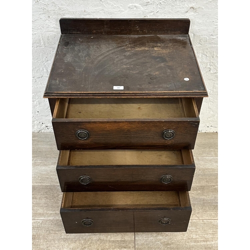 104 - A 1930s oak chest of drawers - approx. 74cm high x 60cm wide x 45cm deep