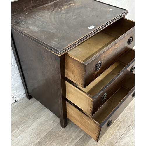 104 - A 1930s oak chest of drawers - approx. 74cm high x 60cm wide x 45cm deep