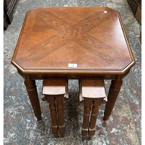 106 - A mahogany and gilt metal nest of three tables - approx. 53cm high x 55cm wide x 55cm deep