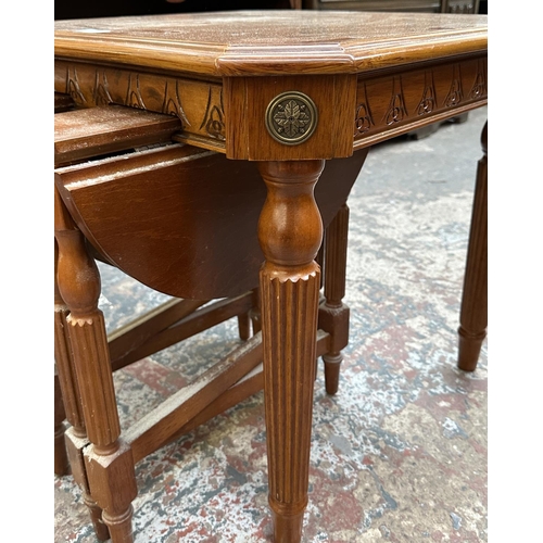 106 - A mahogany and gilt metal nest of three tables - approx. 53cm high x 55cm wide x 55cm deep
