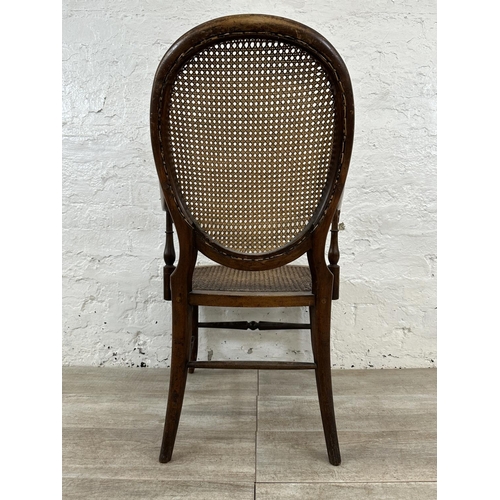 11 - A late 19th/early 20th century mahogany and cane armchair - approx. 93cm high x 57cm wide x 48cm dee... 