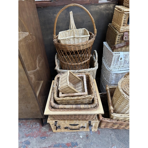 111 - Twenty four various wicker baskets