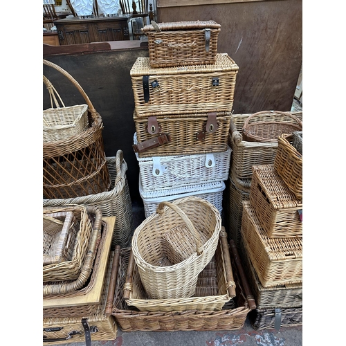 111 - Twenty four various wicker baskets