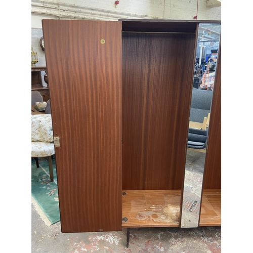 112 - A mid 20th century Meredew walnut double wardrobe - approx. 185cm high x 122cm wide x 56cm deep