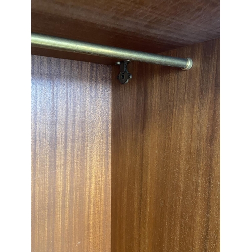 112 - A mid 20th century Meredew walnut double wardrobe - approx. 185cm high x 122cm wide x 56cm deep
