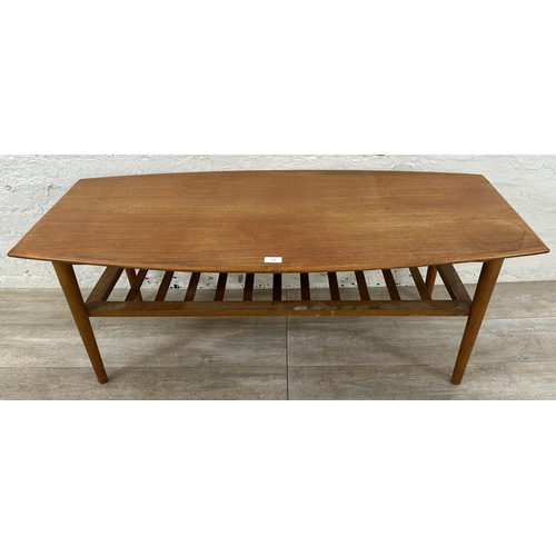 114 - A mid 20th century teak coffee table - approx. 47cm high x 55cm wide x 120cm long