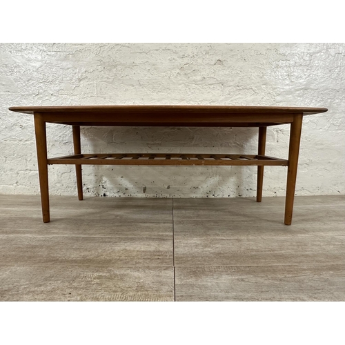 114 - A mid 20th century teak coffee table - approx. 47cm high x 55cm wide x 120cm long