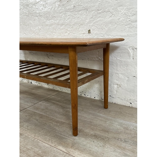 114 - A mid 20th century teak coffee table - approx. 47cm high x 55cm wide x 120cm long