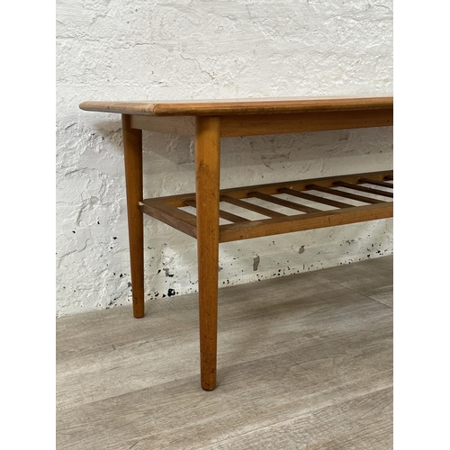 114 - A mid 20th century teak coffee table - approx. 47cm high x 55cm wide x 120cm long