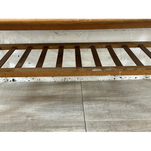 114 - A mid 20th century teak coffee table - approx. 47cm high x 55cm wide x 120cm long