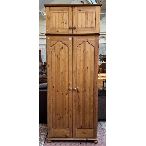 116 - A pine double wardrobe with later added top - approx. 220cm high x 85cm wide x 55cm deep