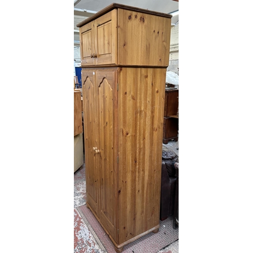 116 - A pine double wardrobe with later added top - approx. 220cm high x 85cm wide x 55cm deep